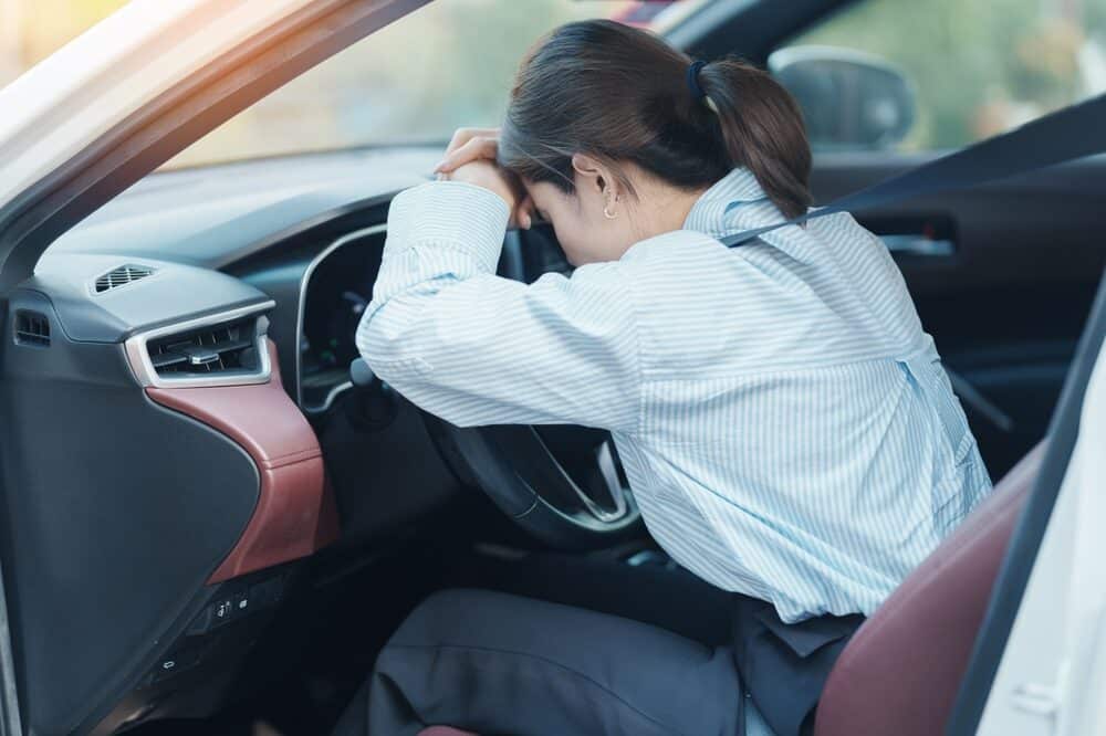 woman feeling stress and angry during drive car long time.