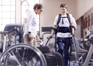 A man going to physical therapy after a spinal cord injury.