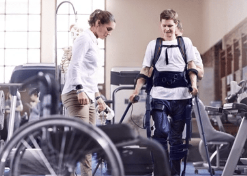A man going to physical therapy after a spinal cord injury.