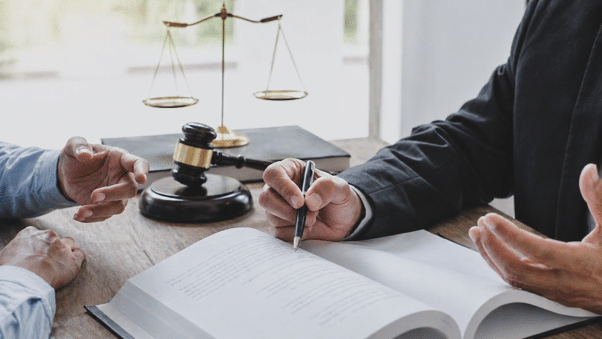 Phoenix car accident lawyer discussing partial fault with a client.