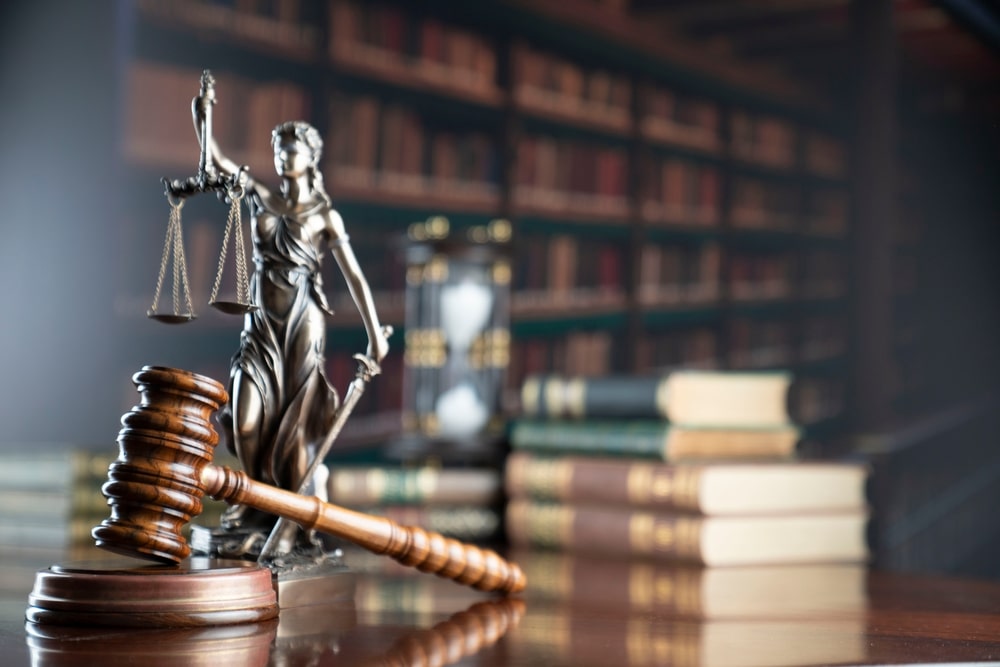 Man points at a graphic that says “law practice” to symbolize the question of what the most common personal injury claim is.