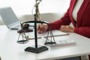 A woman with her arm in a sling consulting a lawyer. Find out how long after a fall you can make a claim.