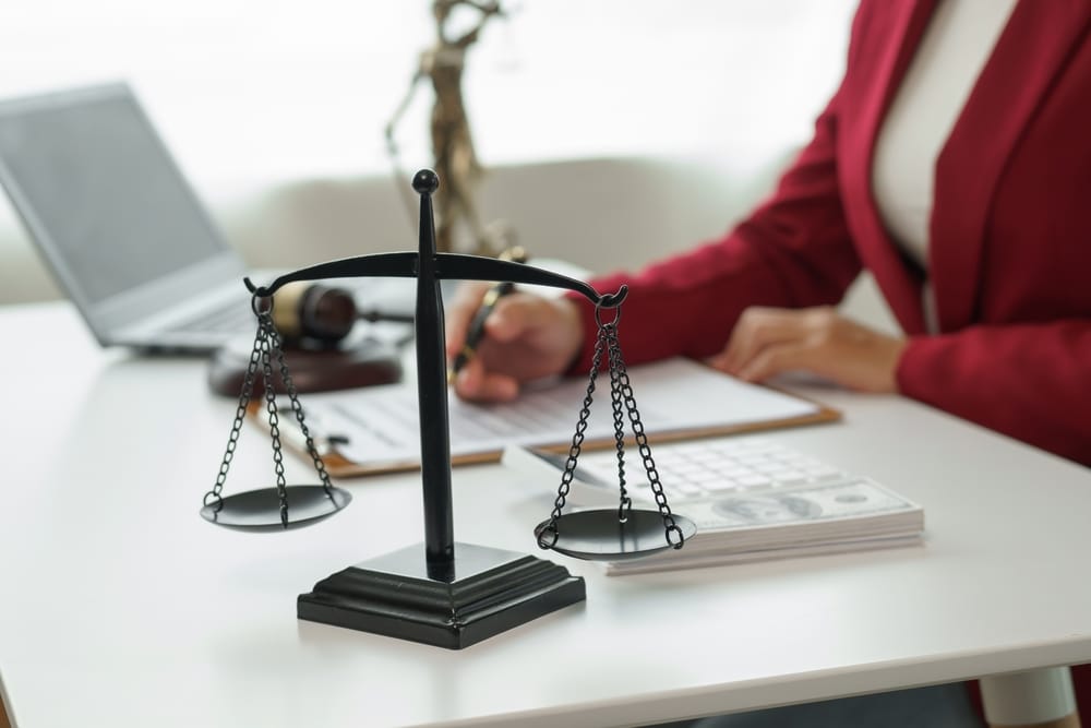 A woman with her arm in a sling consulting a lawyer. Find out how long after a fall you can make a claim.